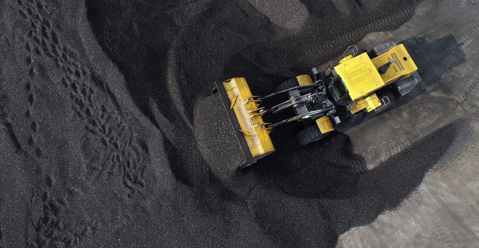 Large machines stack coal in Jiangsu Province, China.