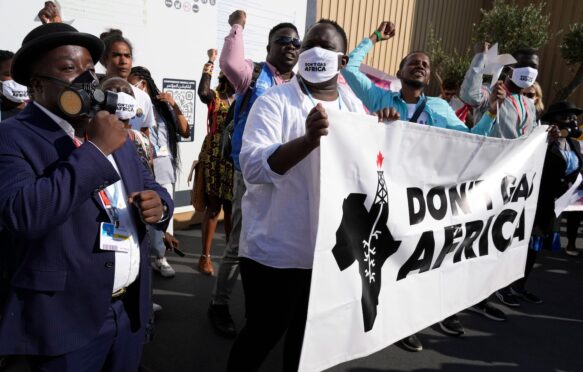 Demonstrators participate in a 'Don't Gas Africa' protest at the COP27.