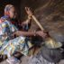 A woman cooking over a fire in Mali, West Africa.