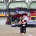 A man carrying a child wades through floodwater in Guangzhou, south China.