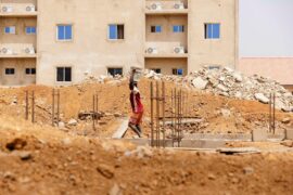 Young man works on a construction site in Nigeria on 6 February 2024.