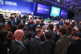 Delegates huddle at closing Plenary of COP26