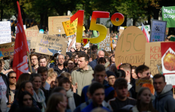 Demonstrators holding up a large 1.5 at Friday for Future protest