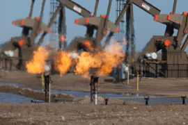 Natural gas is flared off as oil is pumped in the Bakken shale formation. Credit: Jim West / Alamy Stock Photo E1MT0N