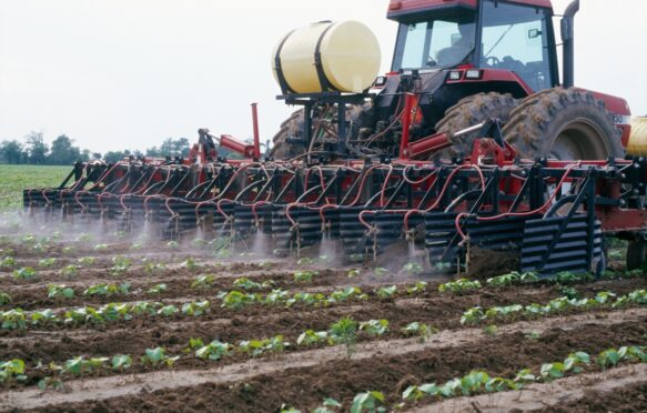 Herbicide being applied to a field of genetically modified cotton in Arkansas, US.