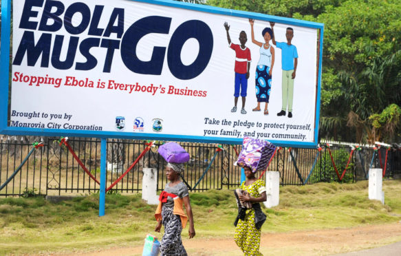 A public service billboard asking everyone to help stop the Ebola outbreak, 15 January 2015, in Monrovia, Liberia. Credit: UNMIL / Alamy Stock Photo. F155K4