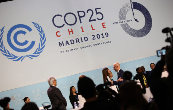 Michał Kurtyka, COP 24 President, Poland, welcomes Carolina Schmidt, COP 25 President, Chile, to the podium to take over the presidency.