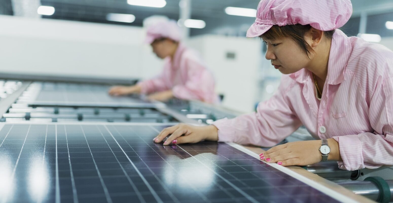 Female workers in solar panel assembly factory, Solar Valley, Dezhou, China.