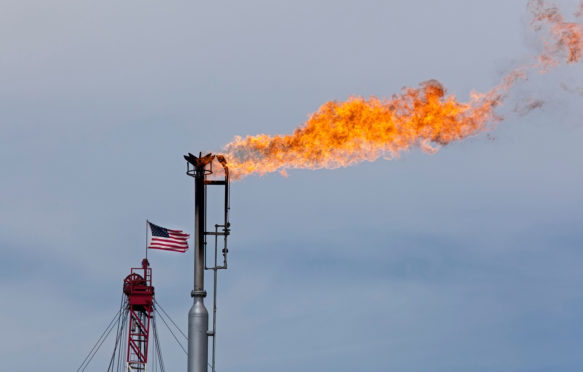 Natural gas is flared off as oil is pumped in the Bakken shale formation, North Dakota, USA