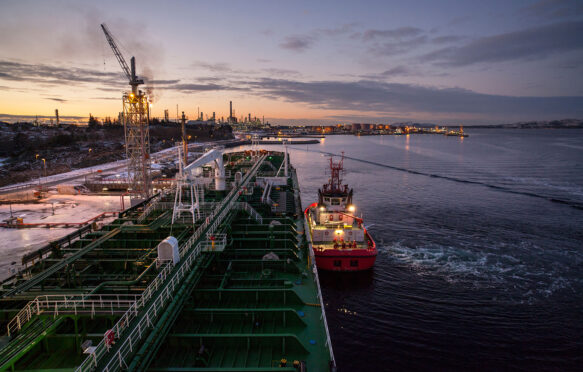 An oil tanker being moored at the Mongstad oil terminal and refinery in Norway. Credit: Ola Moen / Alamy Stock Photo. D1AJ6D