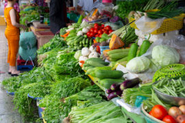 stall with fresh green vegetables on farmers market