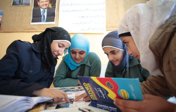 Students at english class. Madaba, Jordan. Credit: Thomas Imo / Alamy Stock Phot