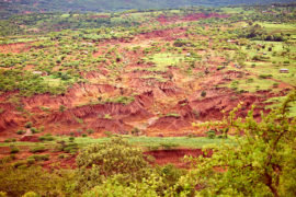 Land erosion caused by deforestation and over-farming, Ngorongoro Highlands, Tanzania. Credit: Stephan Schramm / Alamy Stock Photo. HFA65N