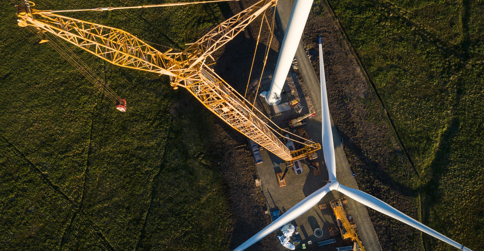 Wind turbine construction showing the propellor being prepared for lifting